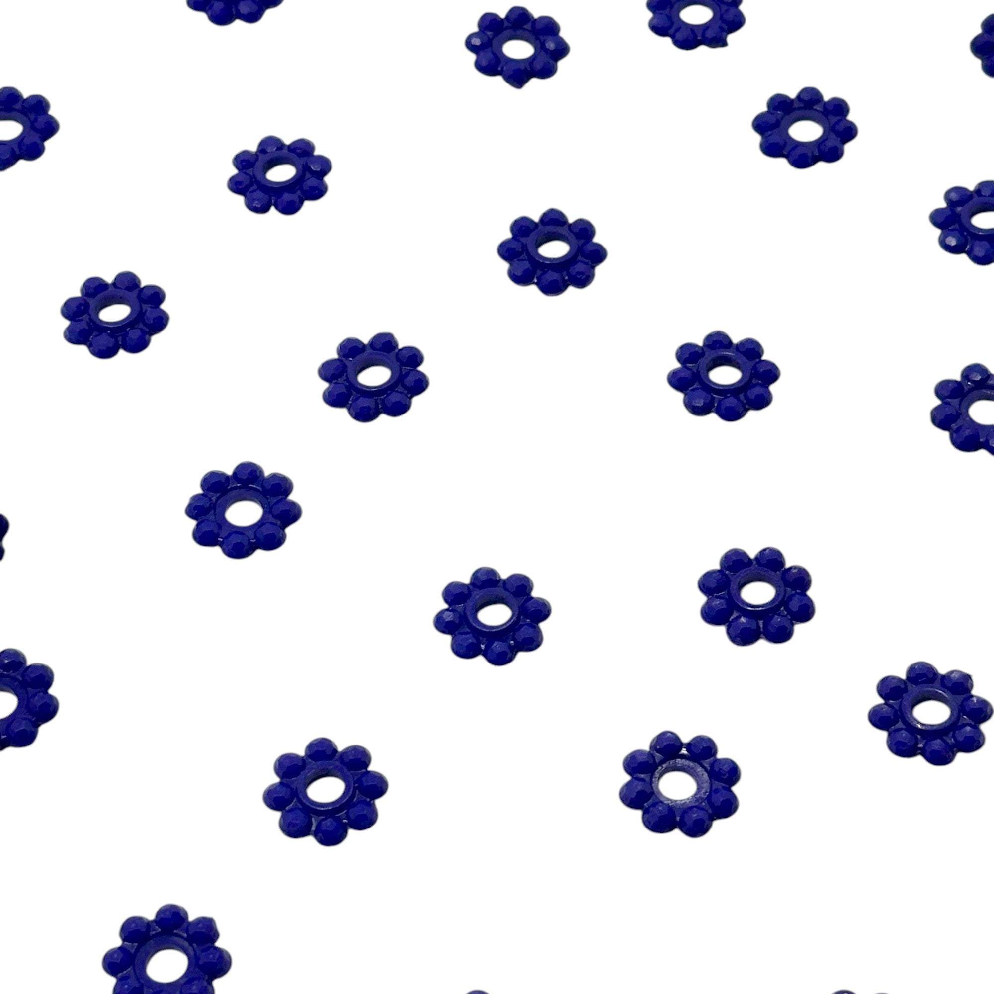 Pattern of blue flower-shaped objects on a white background