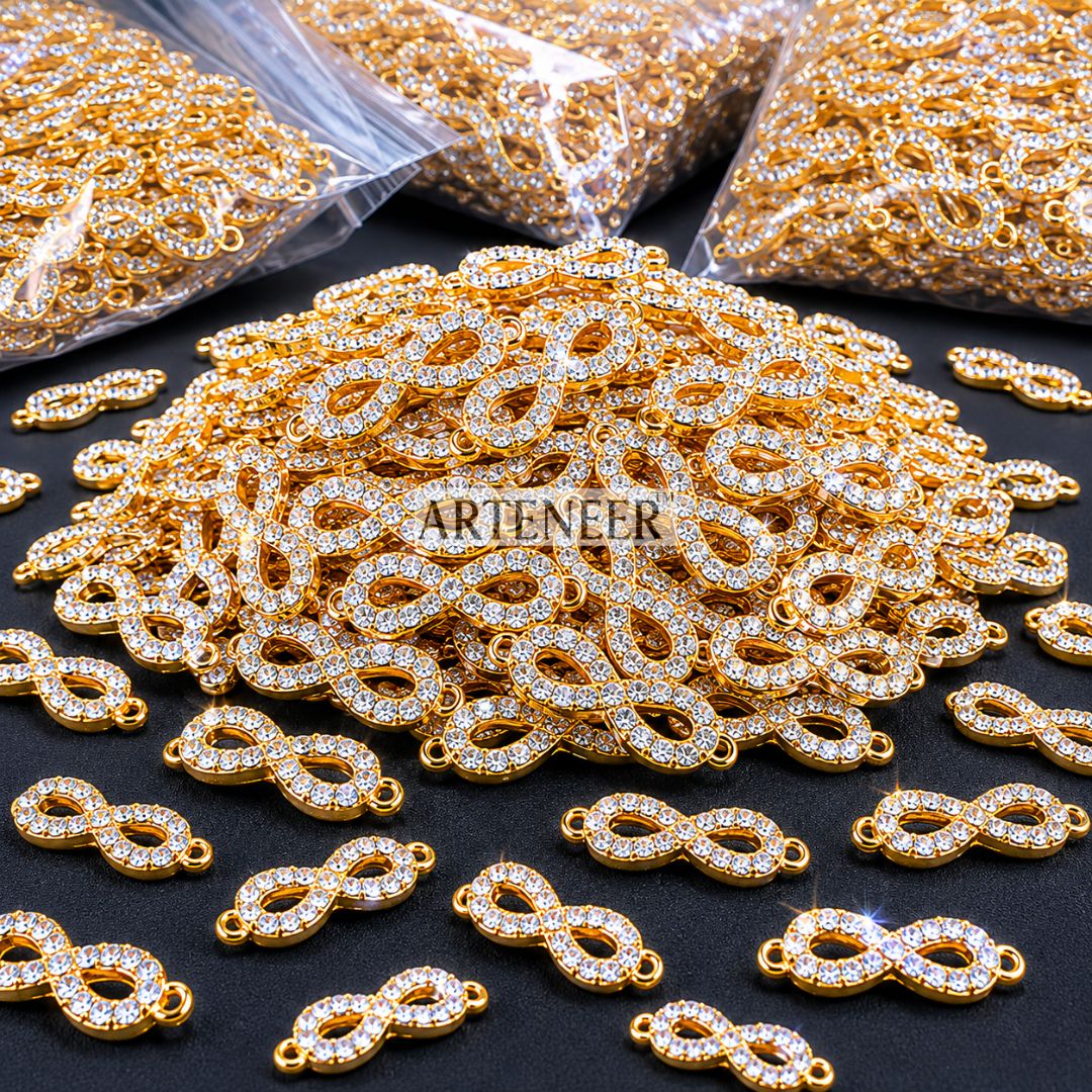 Gold and silver jewelry connectors with 'Arieteener' branding on a black surface.