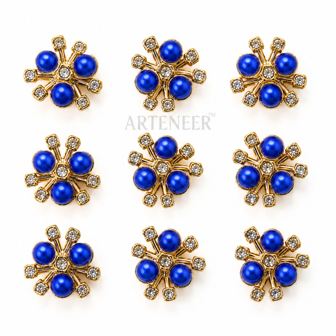 Set of blue flower-shaped earrings with gold and crystal accents on a white background, branded 'Arteneer'.